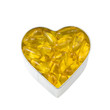 top down view of silver heart filled with salmon oil