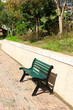 Green wooden bench near the park Green wooden bench near the park