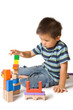 Cute preschool boy playing with wooden blocks Cute preschool boy playing with wooden blocks