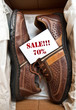 Men's shoes in a box with the label 