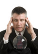 Business man with crystal ball looks for guidance Business man with crystal ball looks for guidance