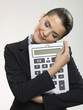 Businesswoman hugging large calculator