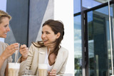 Photo: Two women drinking milkshakes at outdoor caf, Stuttgart, Baden-Wurttemberg, Germany Two women drinking milkshakes at outdoor caf, Stuttgart, Baden-Wurttemberg, Germany