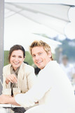 Photo: Young couple drinking milkshakes at outdoor caf, Stuttgart, Baden-Wurttemberg, Germany Young couple drinking milkshakes at outdoor caf, Stuttgart, Baden-Wurttemberg, Germany