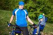 father with son in bicycle chair