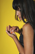 Young woman taking pills, studio shot