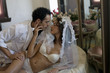 Young multi-ethnic couple in bed on their wedding night