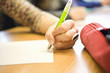 Close-up of hand writing with pen