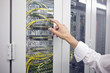 Detail of computer server with hand pointing to it