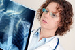 Doctor looking at x-ray image Doctor looking at x-ray image