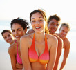 Happy woman with friends at her back on their vacation