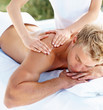 Young guy at the a day spa getting a massage
