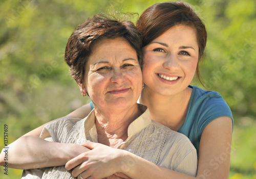 Senior woman with her granddaughter outdoors Senior woman with her granddaughter outdoors