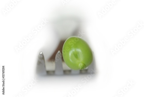 Photo: green peas on fork green peas on fork