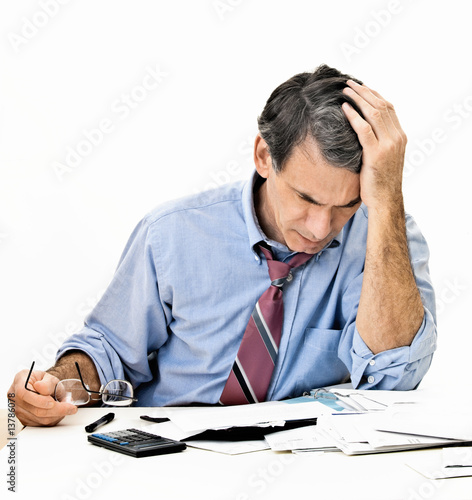 Photo: Man Worrying About Paying Bills and Bankruptcy Man Worrying About Paying Bills and Bankruptcy