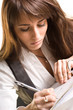 Businesswoman working with invoice