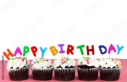 Photo: Happy Birthday Cupcakes with candles and white background Happy Birthday Cupcakes with candles and white background
