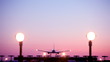 Airplane landing at dusk