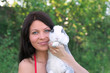 Young smiling woman and rabbit
