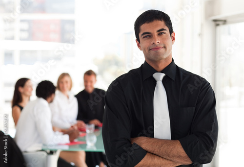 Photo: Business leader in front of his team Business leader in front of his team