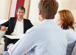Successful bank executive in a discussion with young couple