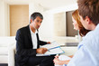 Bank financial advisor in meeting with couple