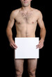 young naked man hiding behind a piece of paper