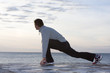 Man doing exercises at the sea
