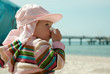 sneezing baby on the beach