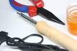 pliers and soldering iron on white background
