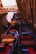 Gondolas in canal side street in Venice Italy Europe Gondolas in canal side street in Venice Italy Europe