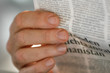 Photo: Hand holding newspaper Hand holding newspaper
