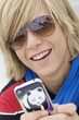 Teenage boy text messaging on a mobile phone