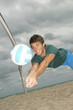 Man playing volleyball on the beach