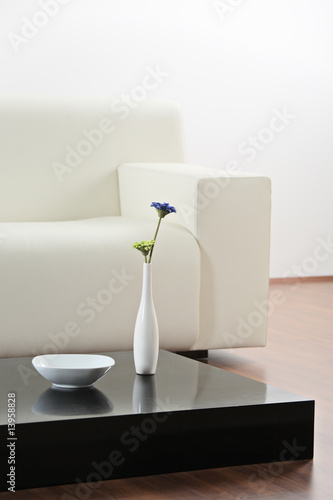 A vase and flower at table in modern  living-room