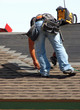 Roofer on roof installing shingles -5-03-09-08