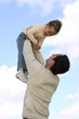 Father lifting little daughter