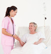 Elderly woman lying in hospital bed