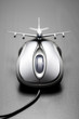 Toy airplane placed on a computer mouse