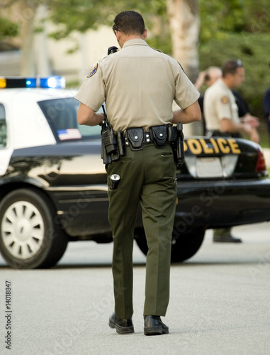 Photo: Cop walking Cop walking