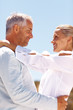 Happy elderly couple embracing eachother