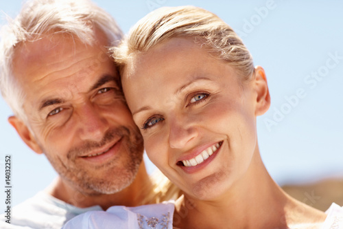 An attractive senior couple smiling together
