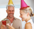 Happy mature couple enjoying a birthday party