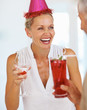 Happy mature woman having fun in a birthday party