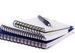 Three spiral notebooks and pen Three spiral notebooks and pen