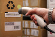 Man hand with barcode scanner in operation. Man hand with barcode scanner in operation.