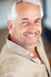 Closeup of a cheerful elderly man, smiling