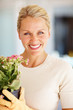 Senior woman with a pot of flower