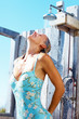 Mature woman having a shower, outdoors