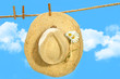 Straw hat on clothesline